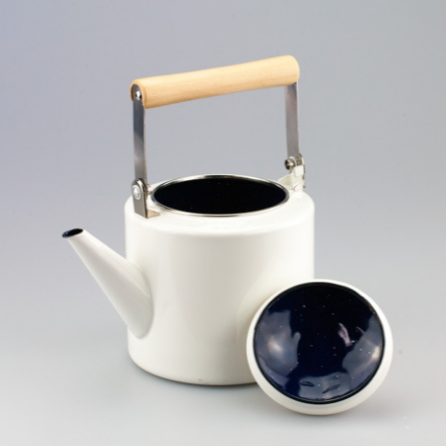 Side view of Scandinavian stoneware teapot showing handle shape