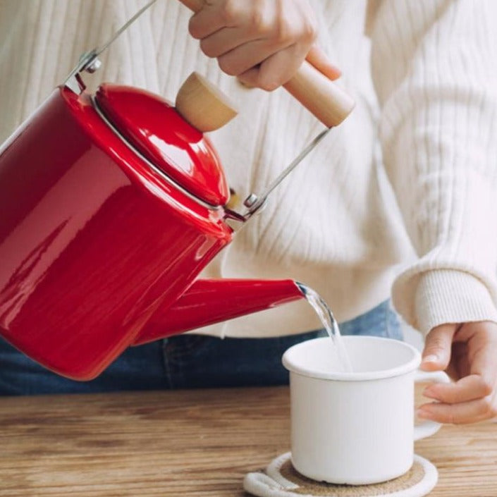 Scandinavian teapot with tea cups in a cozy hygge setting