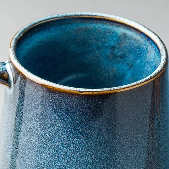 Scandinavian teapot spout close up, smooth matte glaze detail