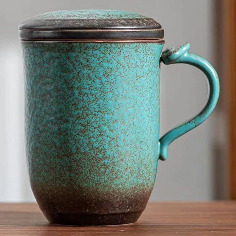 Scandinavian teapot with infuser removed showing steeped loose tea leaves inside