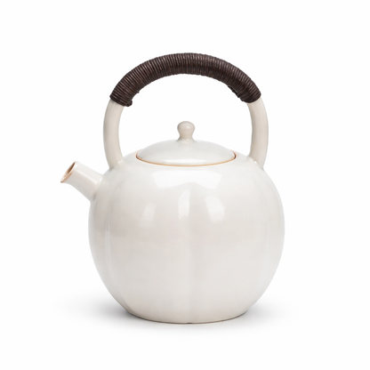 Scandinavian ceramic teapot with infuser in soft matte glaze, hygge style, side view