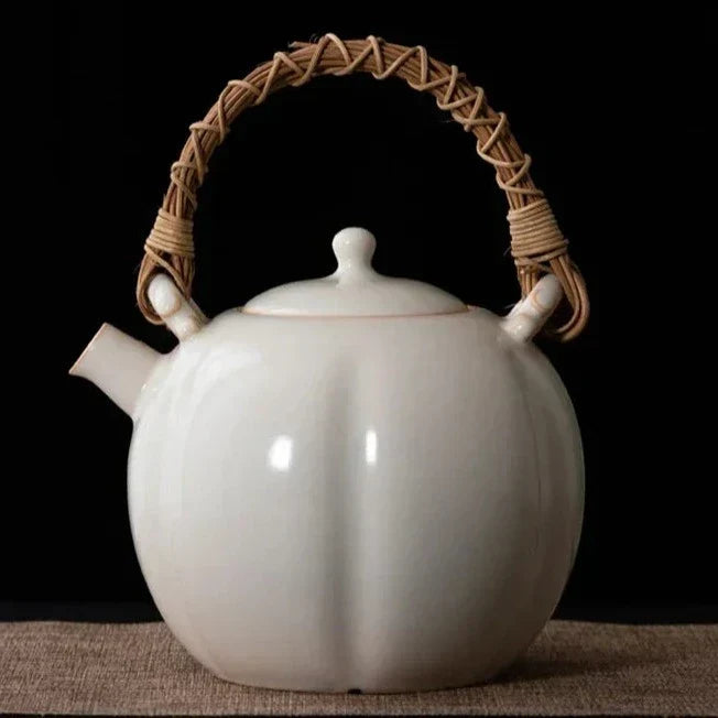 Ceramic hygge teapot with matching cups on wooden table, Granny Lulu selection