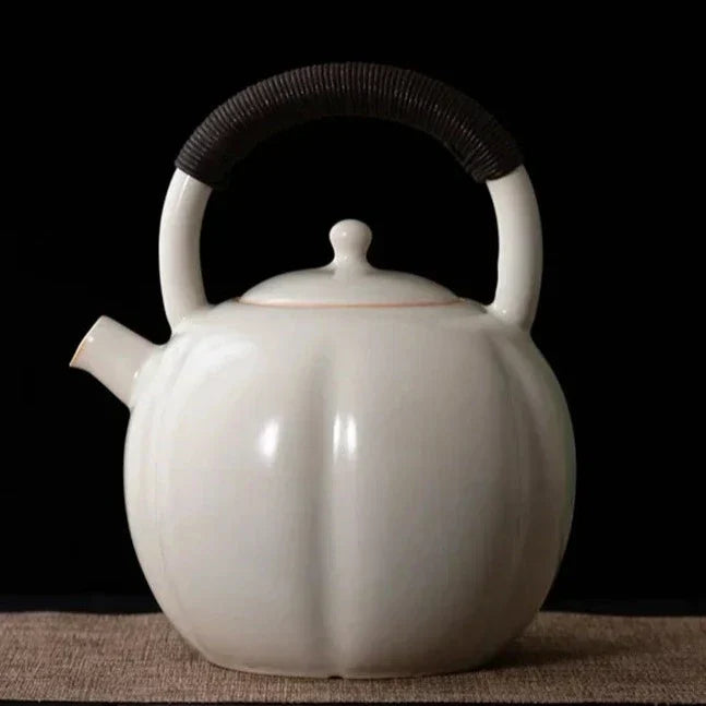 Scandinavian ceramic teapot with steam rising, warm morning tea ritual