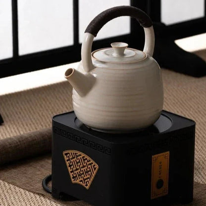 Hand washing Scandinavian ceramic teapot under running water, care routine