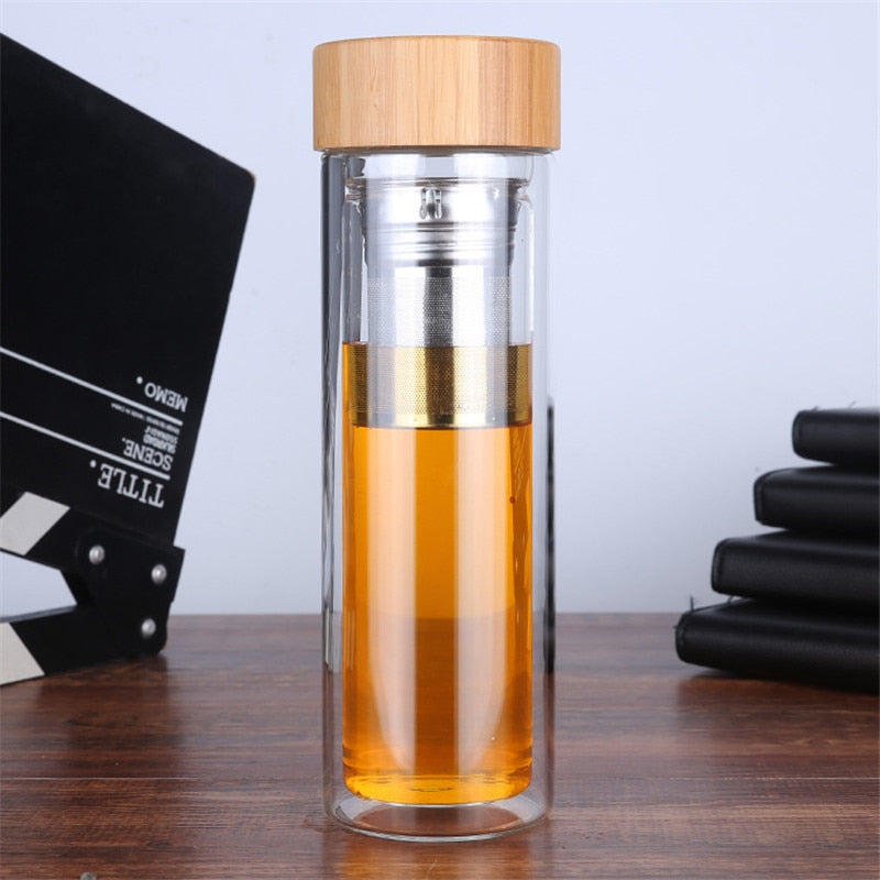 Top view of Scandinavian glass teapot with bamboo handle and stainless steel infuser