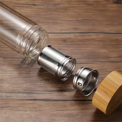 Front view of 450ml double wall glass teapot showing transparent body and bamboo lid