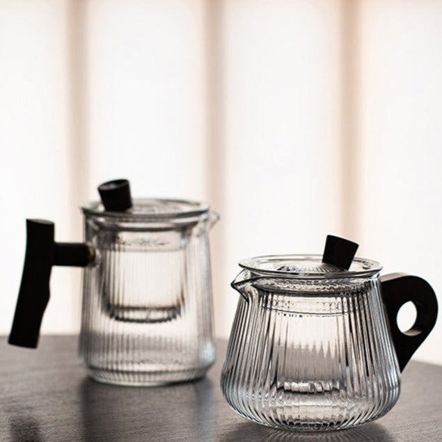 Loose leaf tea brewing inside Scandinavian borosilicate glass teapot