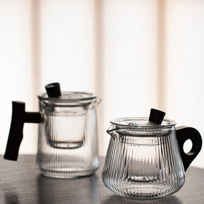 Loose leaf tea brewing inside Scandinavian borosilicate glass teapot