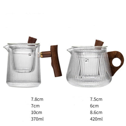 Close-up of stainless steel infuser with visible loose leaf tea inside glass teapot
