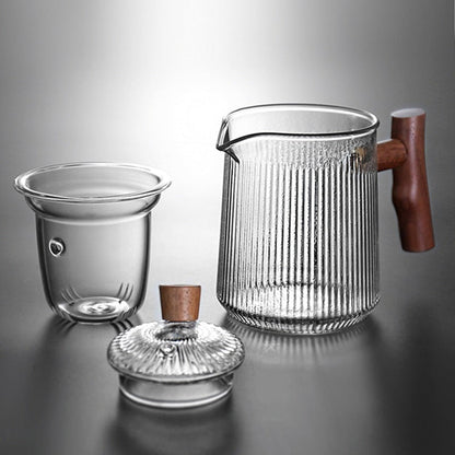 Borosilicate glass teapot with wooden accent handle on kitchen counter