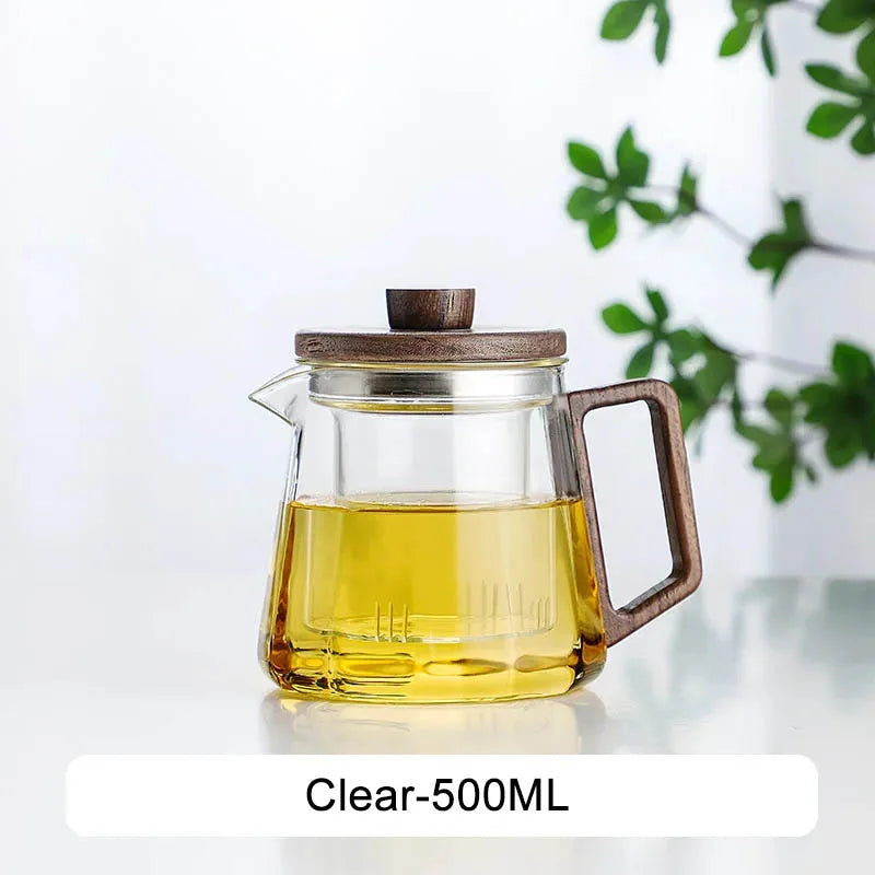Glass teapot with matching cup and saucer, full tea service setup