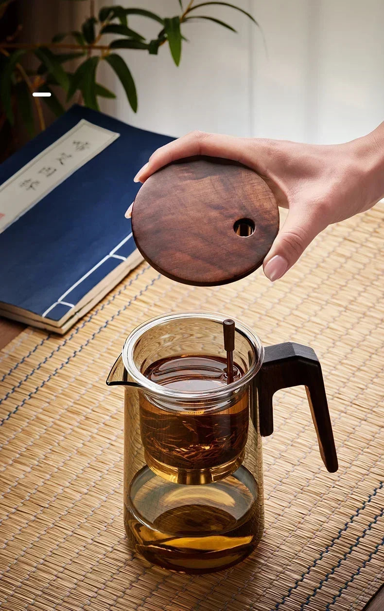 Scandinavian glass teapot with tea and cups