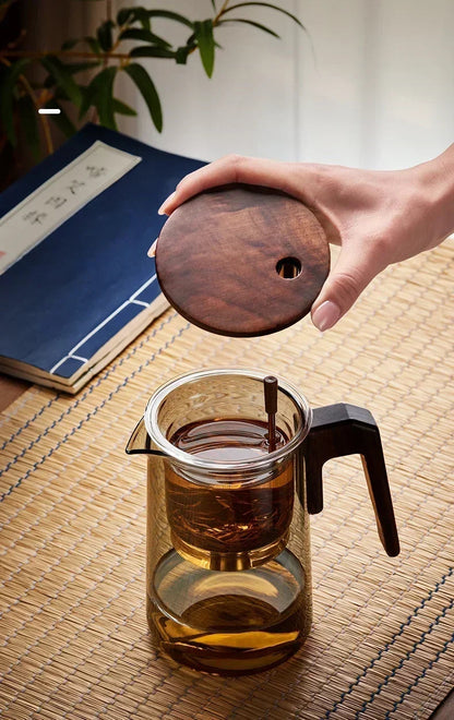 Scandinavian glass teapot with tea and cups