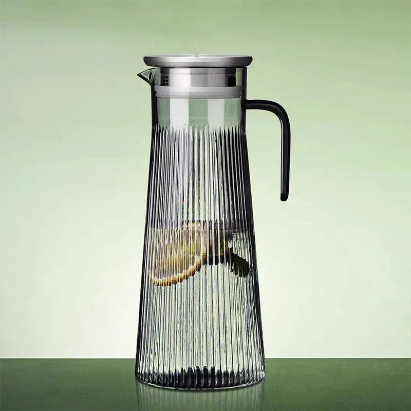 Borosilicate glass teapot brewing green tea, side view