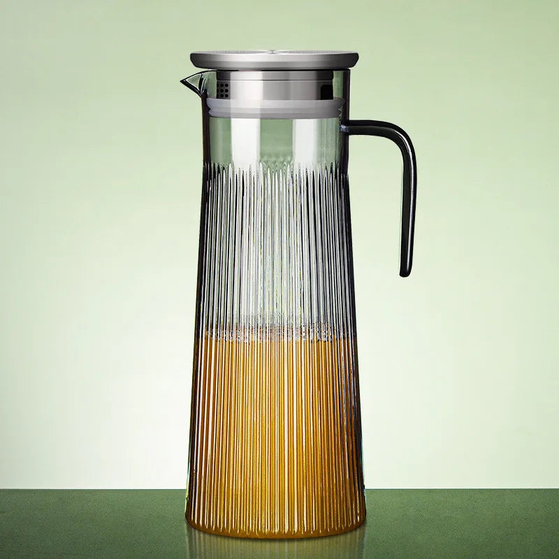 Scandinavian teapot in clear glass with stainless steel infuser inserted