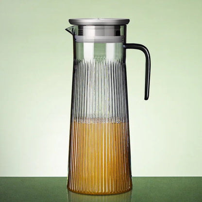 Scandinavian teapot in clear glass with stainless steel infuser inserted
