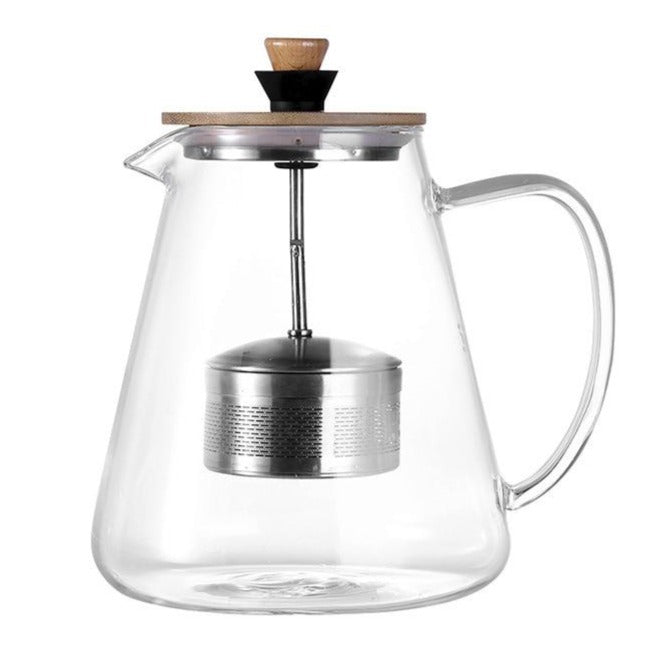 Clear Scandinavian glass teapot showing removable stainless steel infuser basket