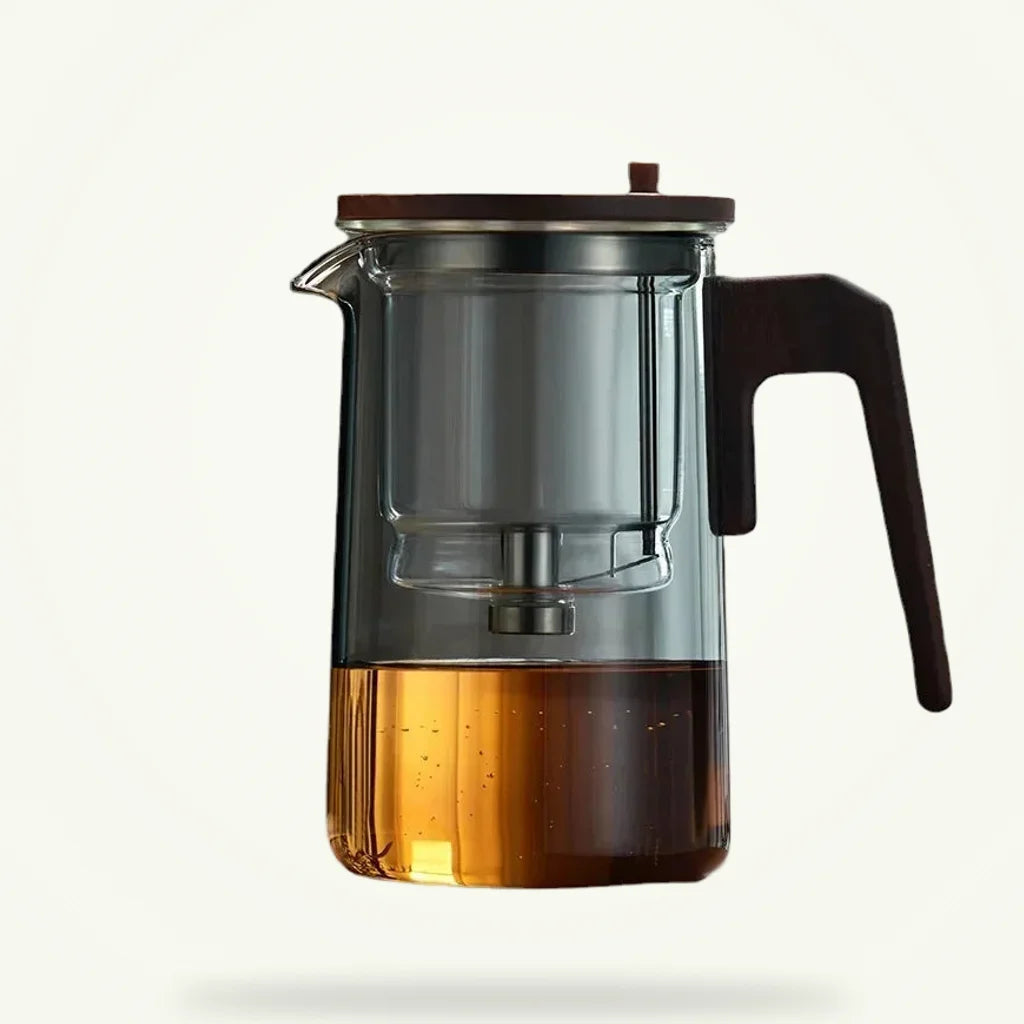 Scandinavian glass teapot with stainless steel infuser, packshot on plain background