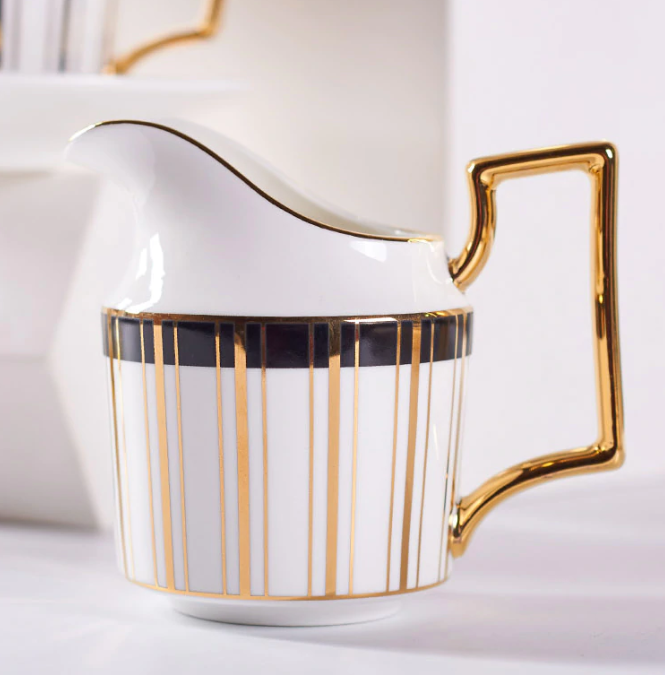 Scandinavian porcelain teapot showing minimalist Nordic profile, side view