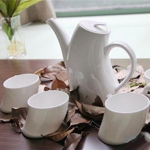 White porcelain teapot and cups set