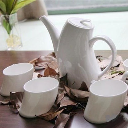 White porcelain teapot and cups set