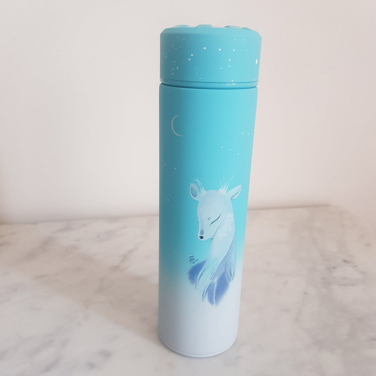 Stainless steel loose leaf teapot with removable infuser basket detail
