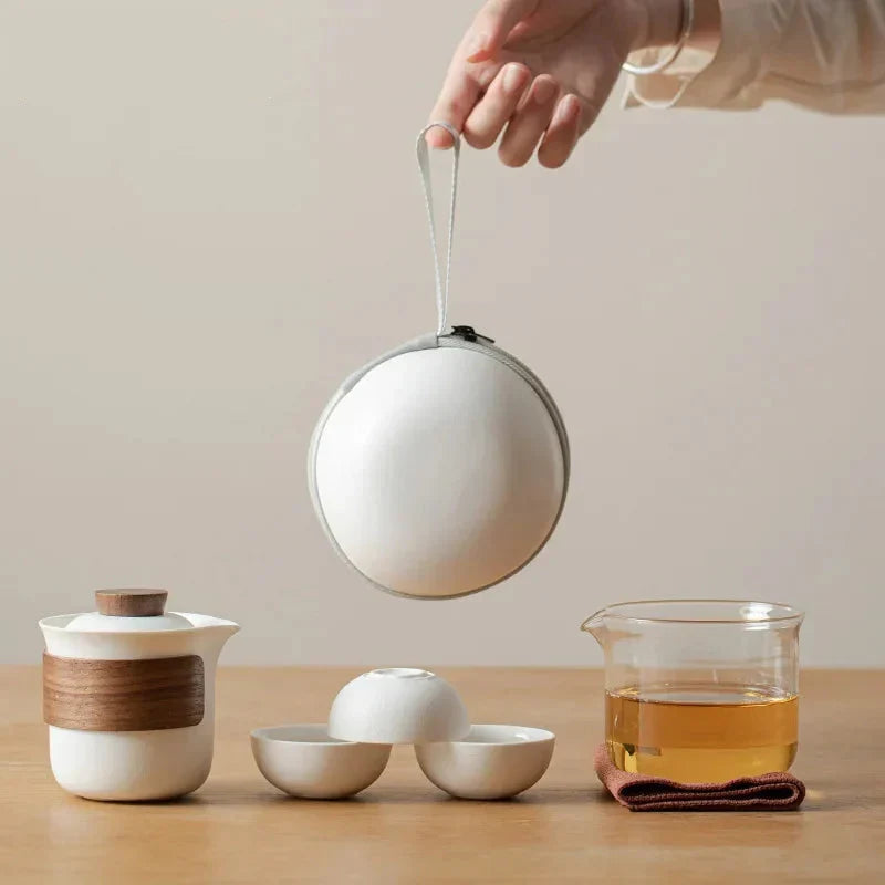 Nordic glass teapot 160ml pouring tea into small white cup