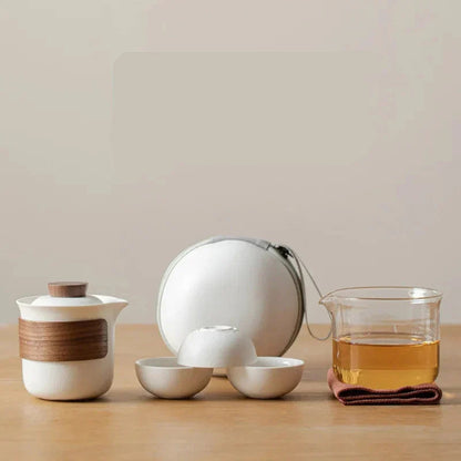 Small clear glass teapot for one with white cup and saucer, Nordic design