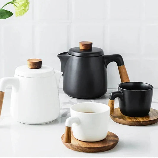 Built-in stainless steel strainer inside minimalist ceramic teapot for loose-leaf tea