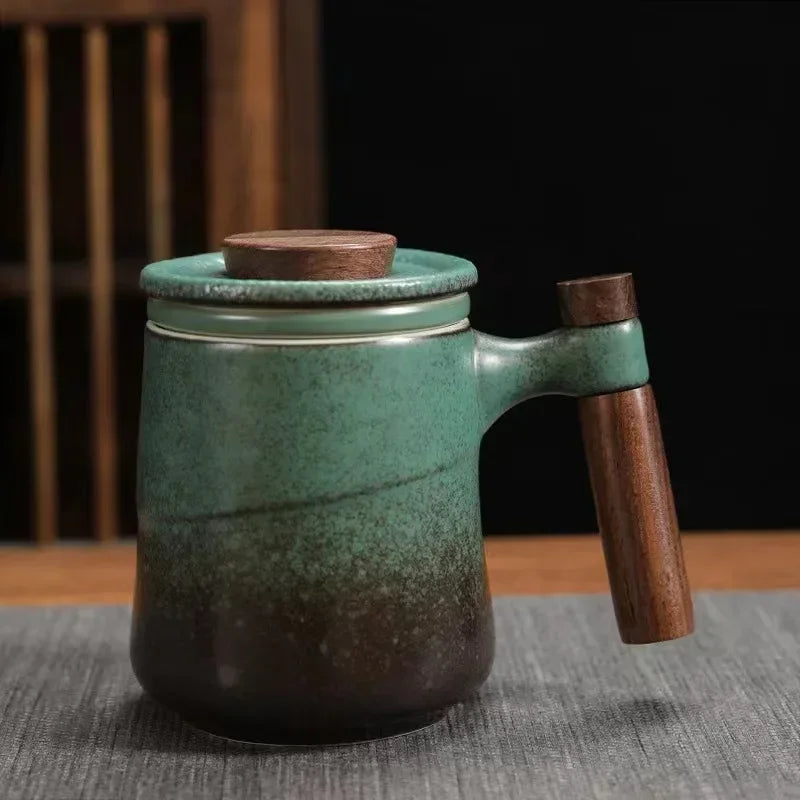 Scandinavian teapot with infuser, lid open showing infuser basket inside