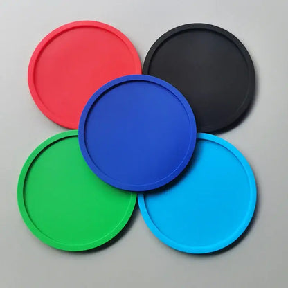 Silicone coaster protecting a wooden table from a hot mug