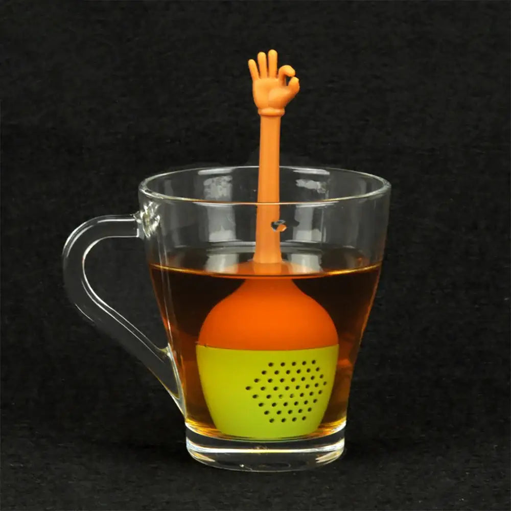 Silicone tea infuser for loose leaf tea, green, on white background