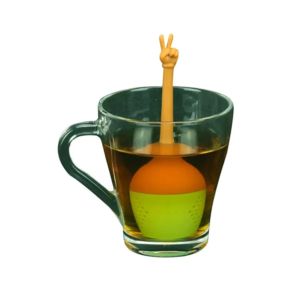 Silicone tea infuser steeping in a glass cup