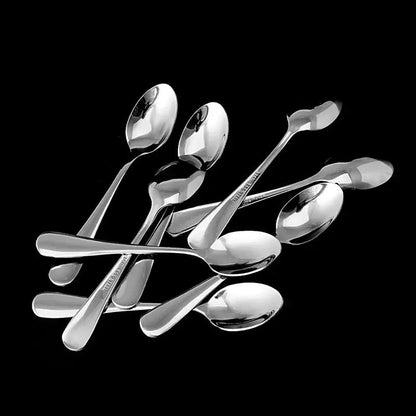 Silver tea spoon set of 6 on a rustic wooden table
