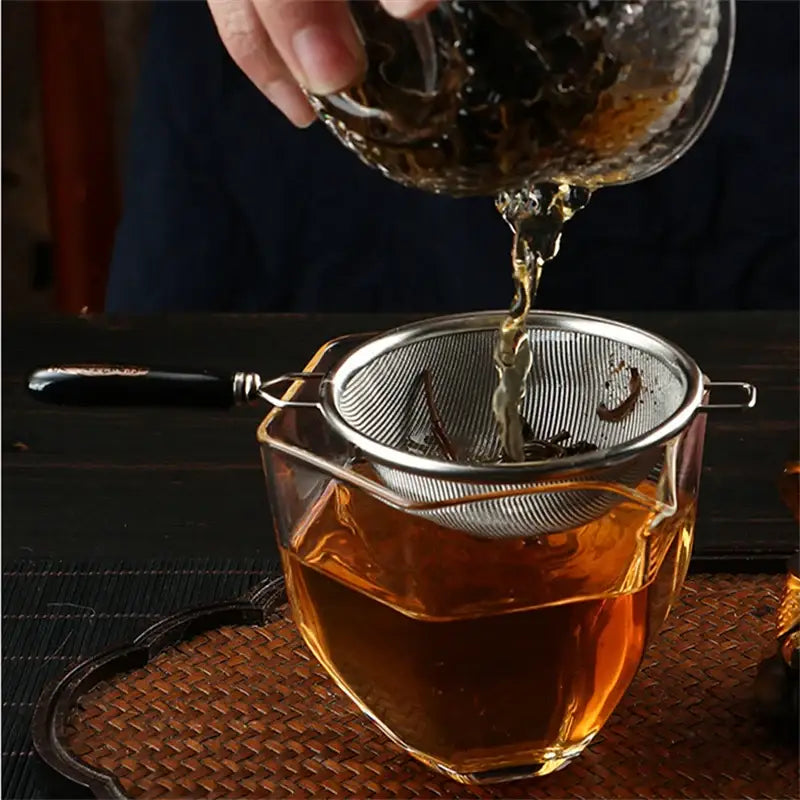 Close-up of fine woven mesh on stainless steel tea strainer