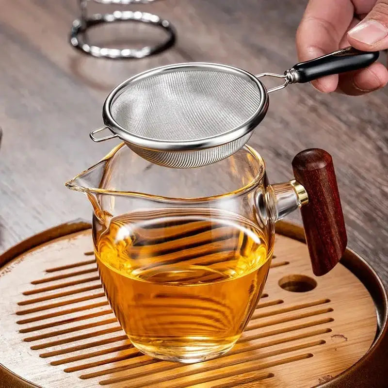 Stainless steel infuser with loose leaf green tea ready to brew