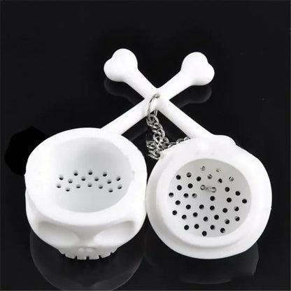 Skull tea infuser in a white mug