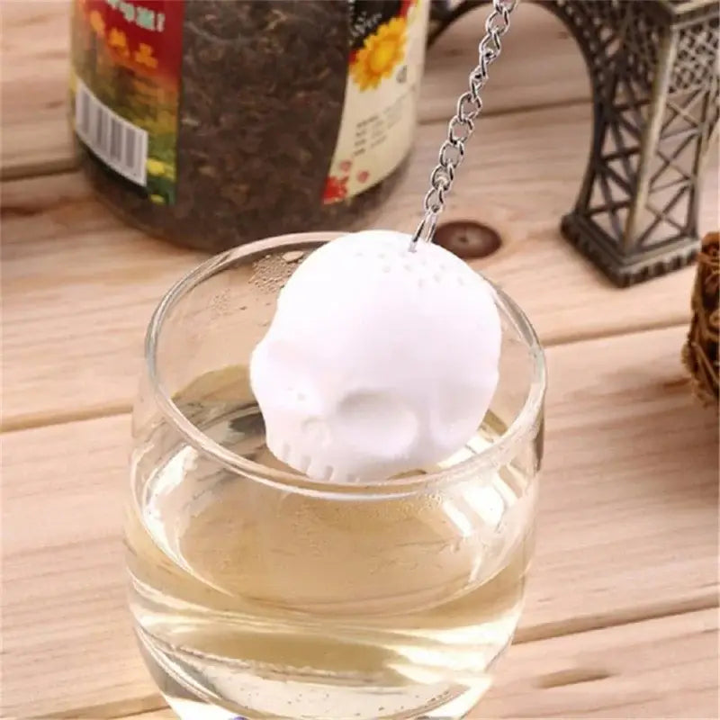 Skull tea infuser being filled with tea leaves
