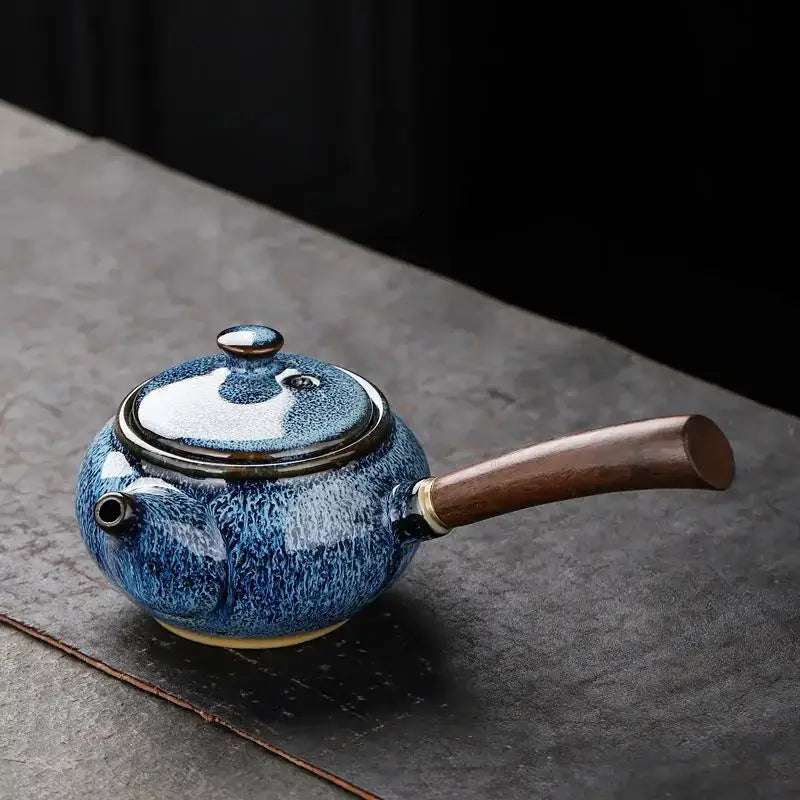 Blue small ceramic teapot with matching cup