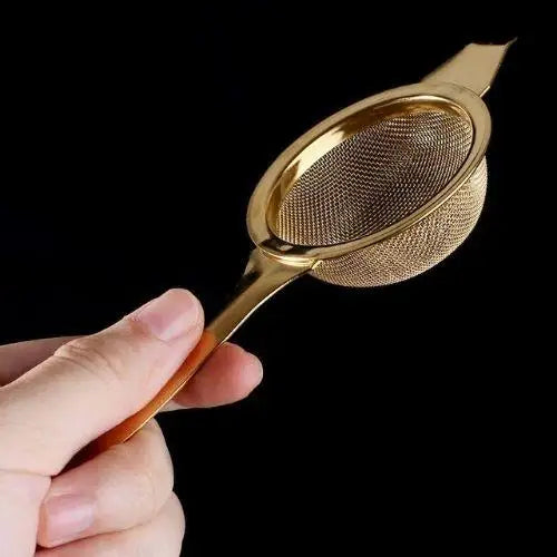 Gold and silver loose leaf tea strainers shown side by side