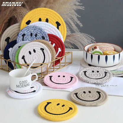 Handwoven cotton smiley coasters stacked together