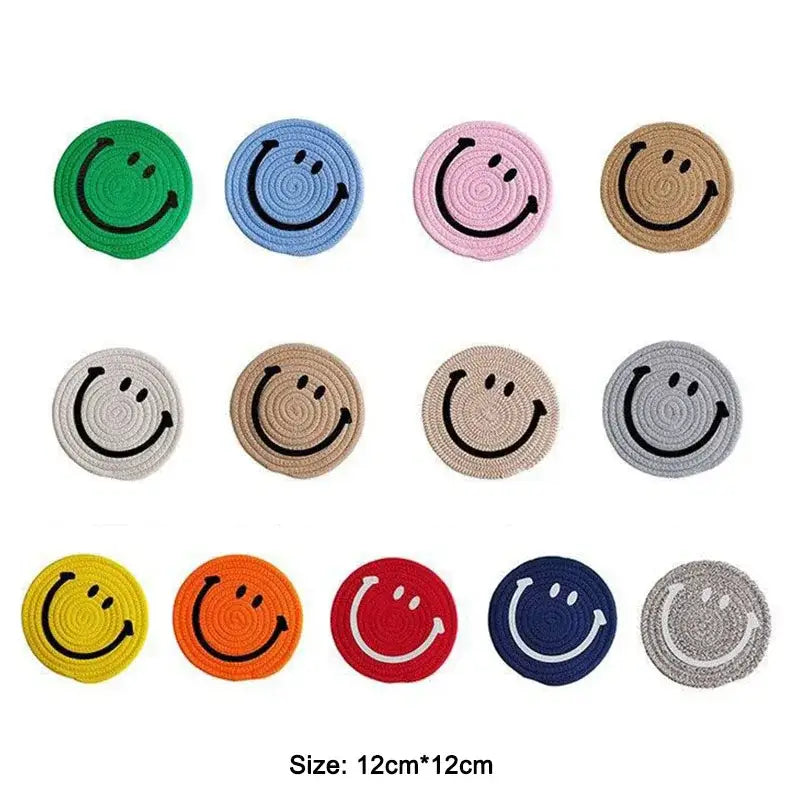 Close up of a smiley coaster with a cup of tea
