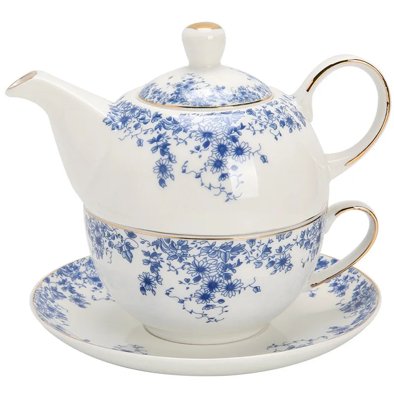 Porcelain teapot for one with matching cup and saucer front view