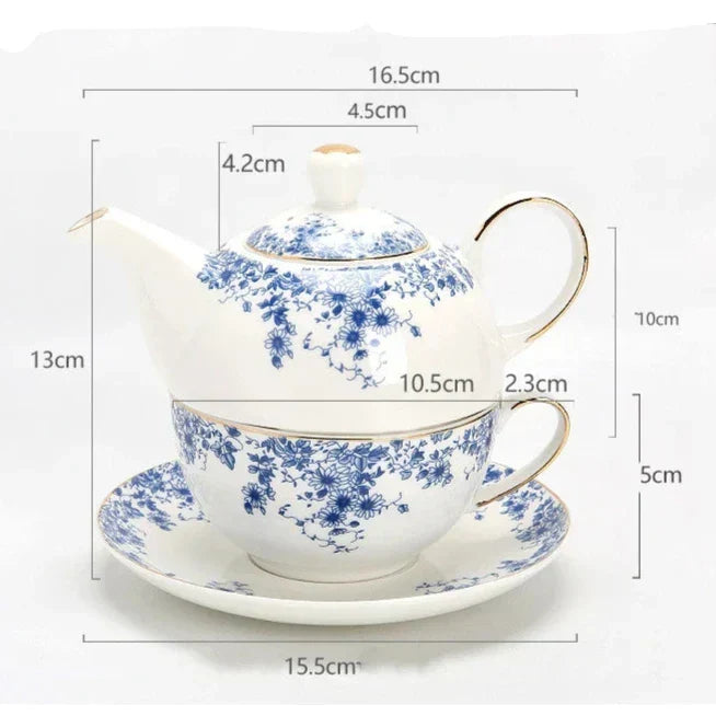 Porcelain teapot for one with cup and saucer side angle