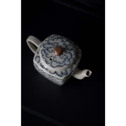 Square porcelain teapot on kitchen counter