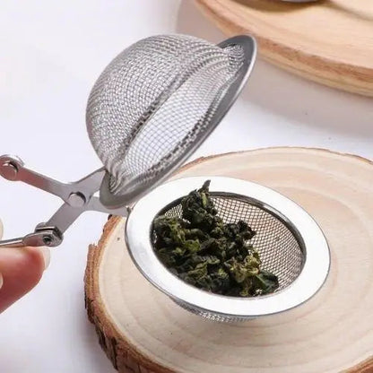 Round stainless steel tea infuser ball shown open and closed