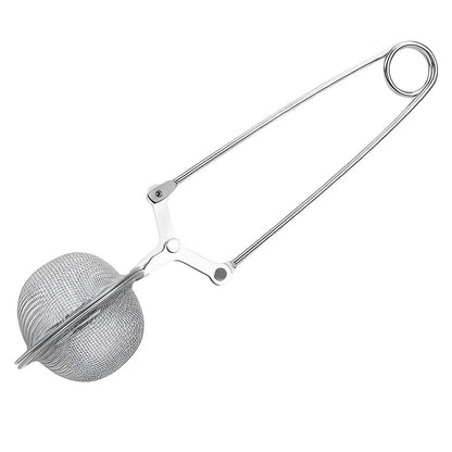 Fine mesh ball tea infuser filled with loose-leaf green tea