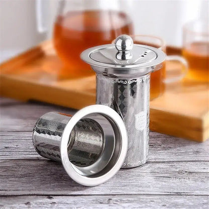 Tea infuser with lid open showing loose tea leaves