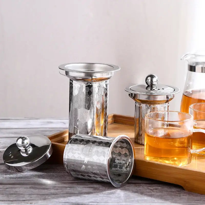 Tea infuser being cleaned under running water