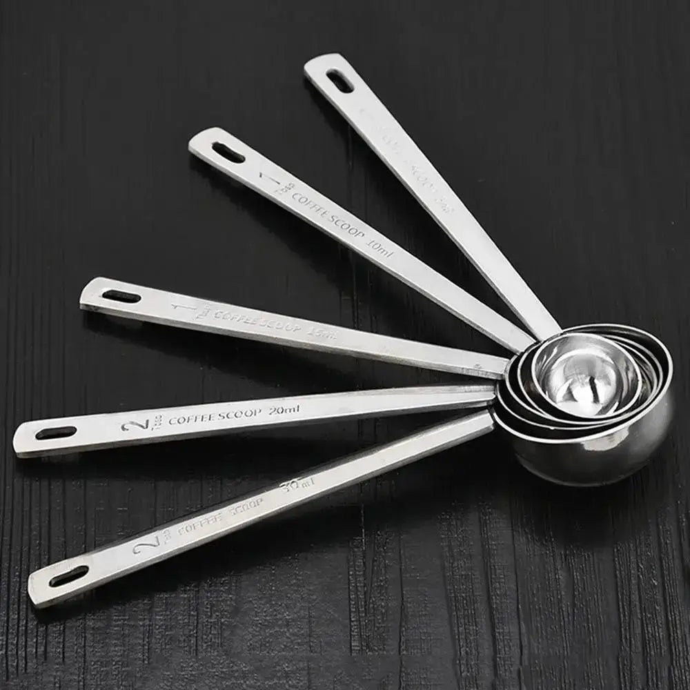 Tea measuring spoon with hole for hanging